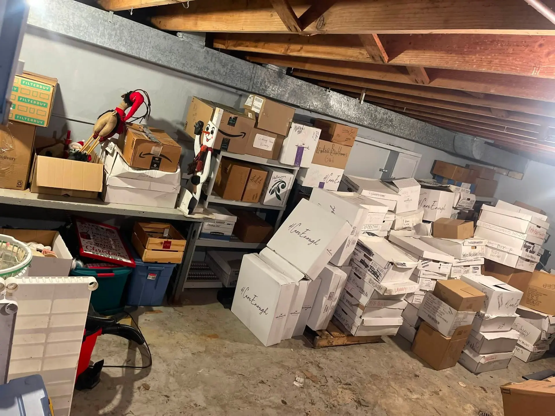 Basement storage cleanout with stacked boxes and shelving